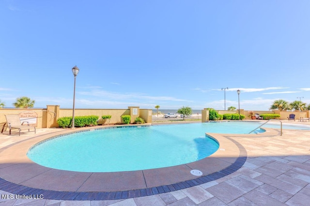 view of swimming pool with a patio