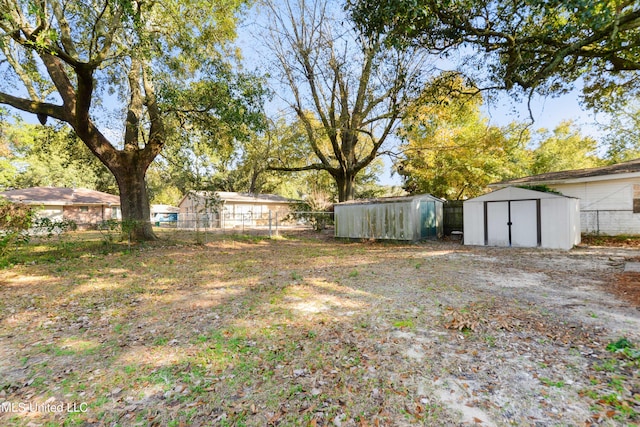 view of yard with a storage unit