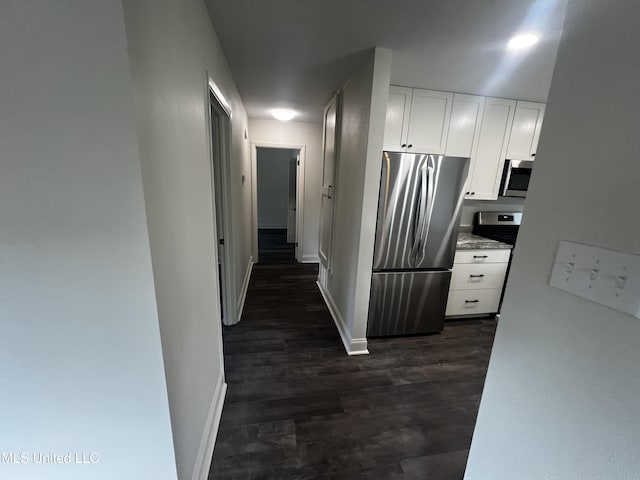 hallway with dark wood-type flooring