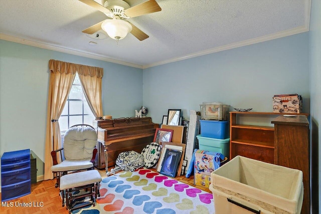 living area featuring parquet flooring, ornamental molding, a textured ceiling, and ceiling fan