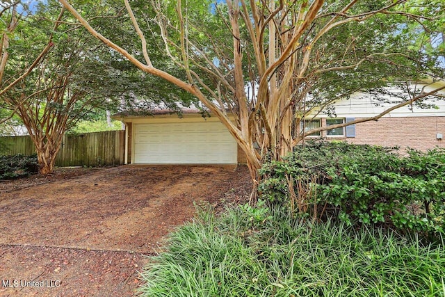 garage featuring fence