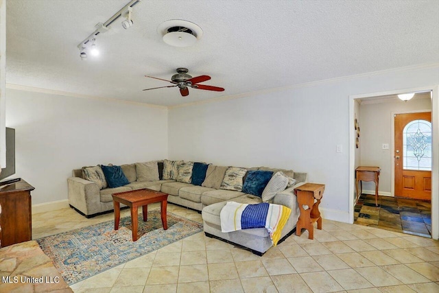 living room with crown molding, a textured ceiling, and ceiling fan