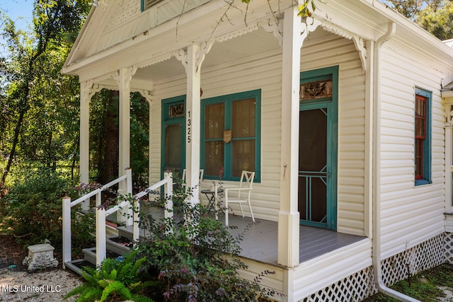 view of property exterior with covered porch