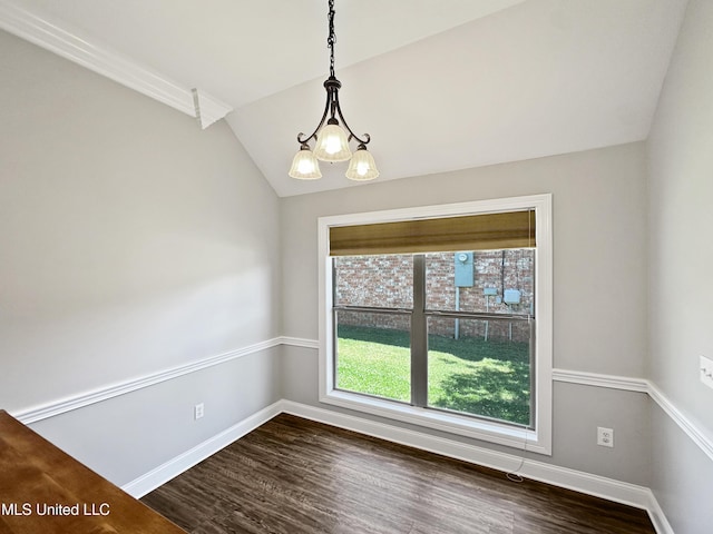 unfurnished dining area with baseboards, vaulted ceiling, dark wood-style floors, and a chandelier