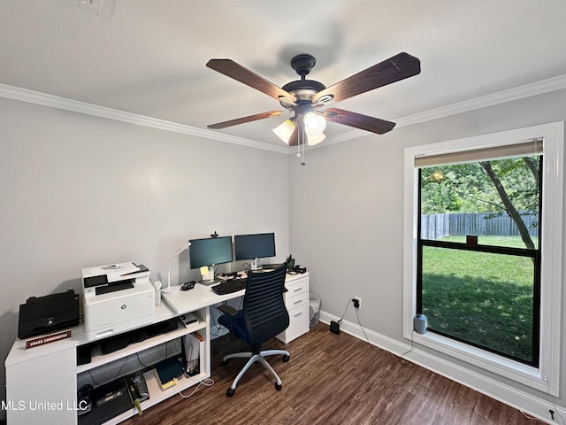 home office featuring crown molding, a ceiling fan, dark wood-style flooring, and baseboards