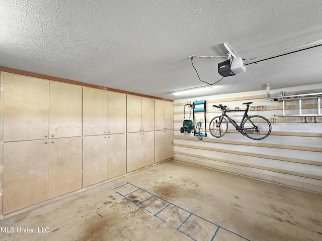garage featuring a garage door opener