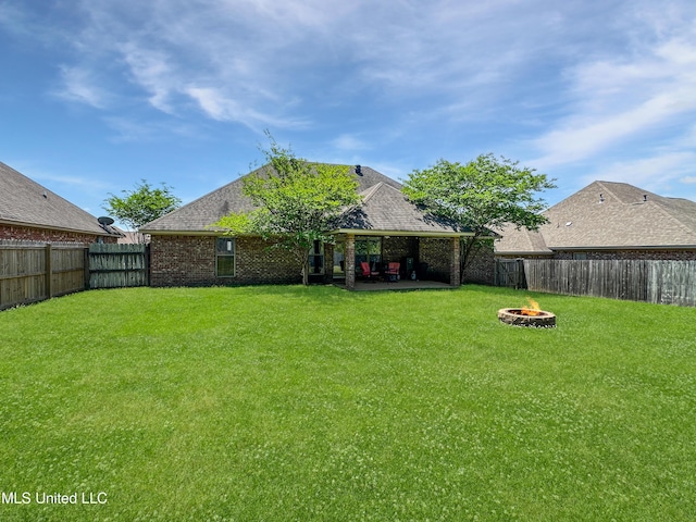 view of yard featuring a patio, a gazebo, a fenced backyard, and an outdoor fire pit