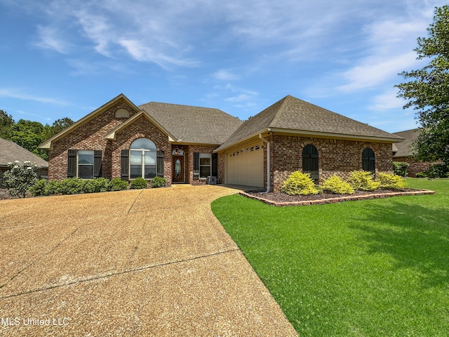 ranch-style house with a shingled roof, an attached garage, brick siding, a front yard, and driveway