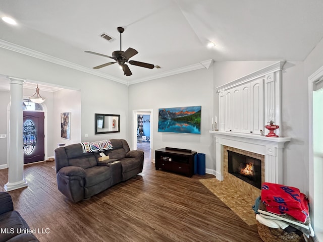 living area with ceiling fan, dark wood-style flooring, visible vents, a fireplace, and baseboards