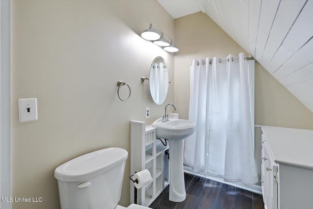 121 Countrywood Cir, Clinton, MS 39056 - bathroom featuring lofted ceiling, toilet, and wood finished floors