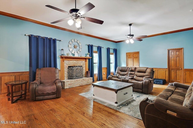 121 Countrywood Cir, Clinton, MS 39056 - living area featuring a ceiling fan, a wainscoted wall, wood finished floors, and ornamental molding