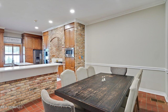 121 Countrywood Cir, Clinton, MS 39056 - dining room with brick floors, crown molding, recessed lighting, and baseboards
