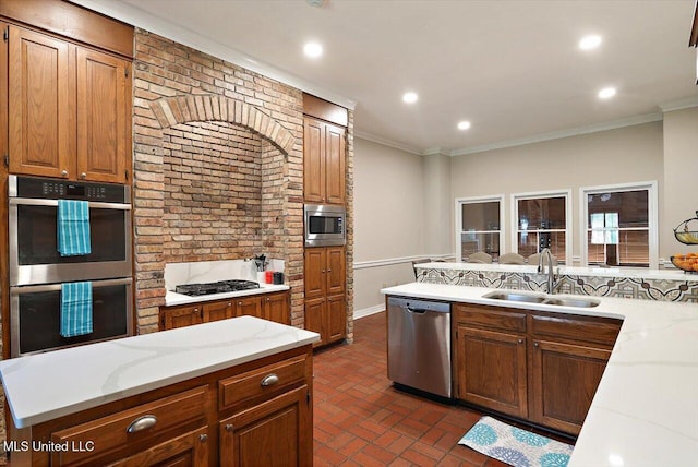 121 Countrywood Cir, Clinton, MS 39056 - kitchen with appliances with stainless steel finishes, a sink, brick flooring, ornamental molding, and light stone counters
