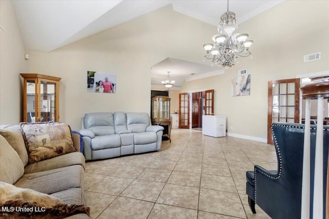 6313 Hermosa Dr, Ocean Springs, MS 39564 - living room with a chandelier, high vaulted ceiling, light tile patterned floors, crown molding, and baseboards