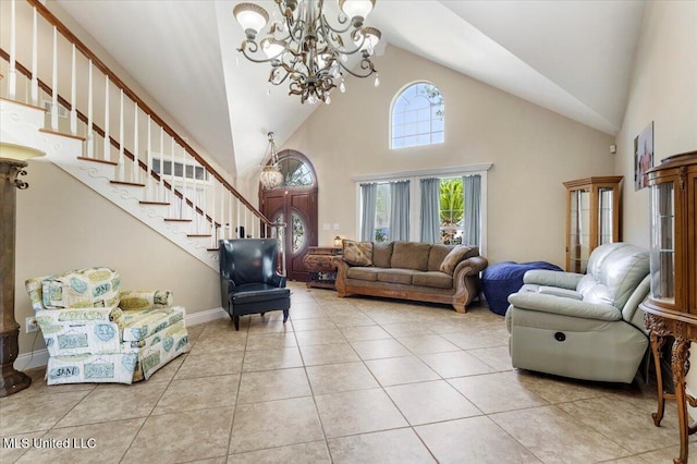6313 Hermosa Dr, Ocean Springs, MS 39564 - living area featuring a chandelier, high vaulted ceiling, tile patterned floors, and stairs