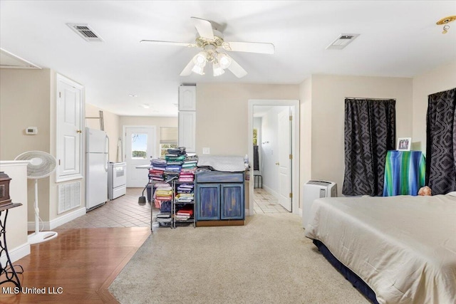 6313 Hermosa Dr, Ocean Springs, MS 39564 - bedroom with freestanding refrigerator, baseboards, and light tile patterned flooring