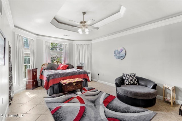 6313 Hermosa Dr, Ocean Springs, MS 39564 - bedroom featuring light tile patterned floors, a ceiling fan, ornamental molding, baseboards, and a tray ceiling