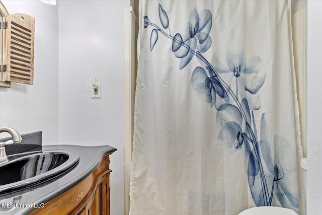 6313 Hermosa Dr, Ocean Springs, MS 39564 - bathroom with vanity, toilet, and a shower with shower curtain