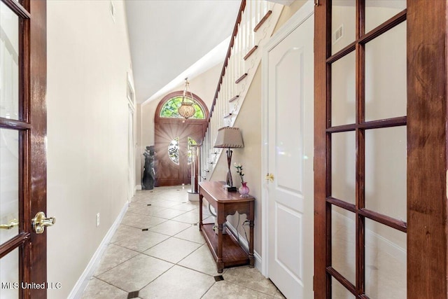 6313 Hermosa Dr, Ocean Springs, MS 39564 - corridor with baseboards, light tile patterned flooring, and vaulted ceiling