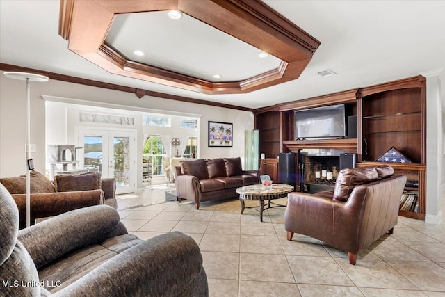 6313 Hermosa Dr, Ocean Springs, MS 39564 - living area featuring crown molding, light tile patterned flooring, a raised ceiling, french doors, and recessed lighting