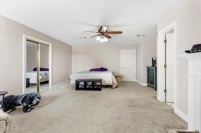 6313 Hermosa Dr, Ocean Springs, MS 39564 - carpeted bedroom featuring baseboards, a ceiling fan, and a closet