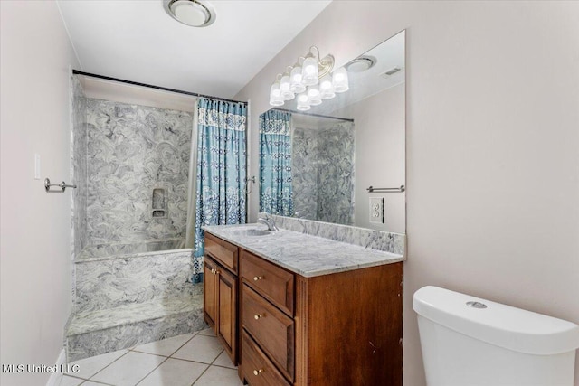 6313 Hermosa Dr, Ocean Springs, MS 39564 - full bathroom with tile patterned flooring, shower / bath combo with shower curtain, vanity, and toilet