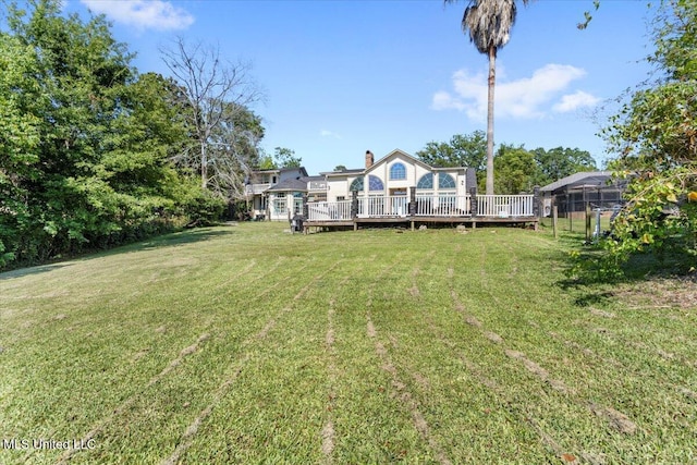 6313 Hermosa Dr, Ocean Springs, MS 39564 - view of grassy yard with a wooden deck