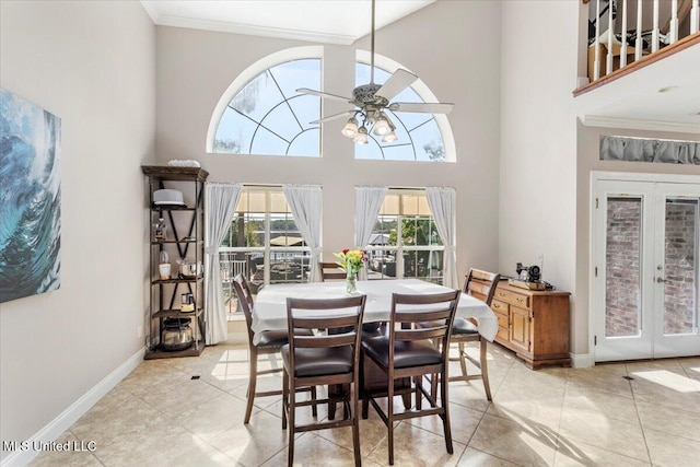 6313 Hermosa Dr, Ocean Springs, MS 39564 - dining space featuring a high ceiling, light tile patterned floors, a ceiling fan, baseboards, and french doors