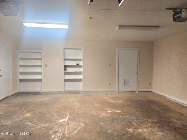 1618 Pear Orchard Pl, Jackson, MS 39211 - garage featuring visible vents, baseboards, and a garage door opener