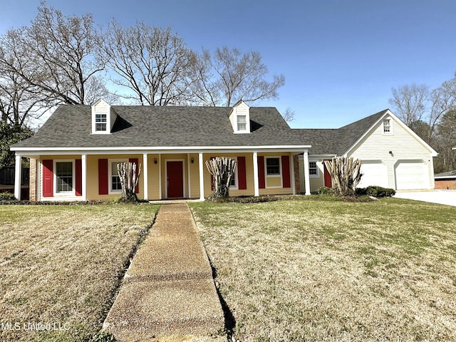 1618 Pear Orchard Pl, Jackson, MS 39211 - cape cod home with an attached garage, driveway, a shingled roof, and a front yard