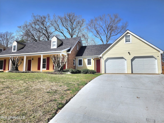 1618 Pear Orchard Pl, Jackson, MS 39211 - new england style home featuring an attached garage, concrete driveway, a front lawn, and a shingled roof