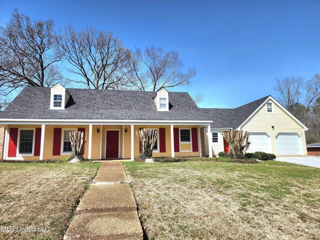 1618 Pear Orchard Pl, Jackson, MS 39211 - new england style home with an attached garage, concrete driveway, a front lawn, and roof with shingles