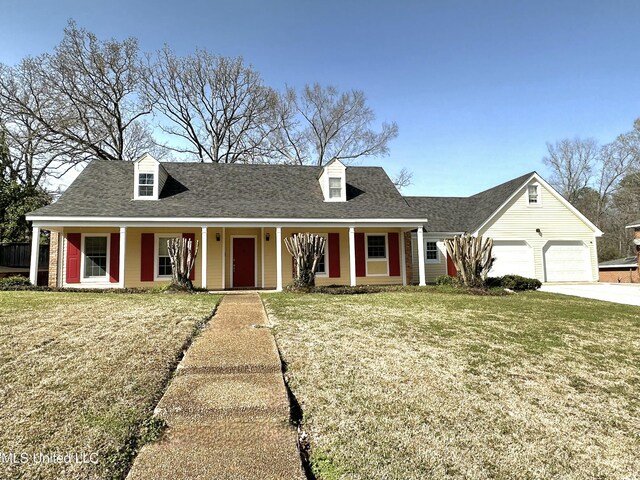 1618 Pear Orchard Pl, Jackson, MS 39211 - cape cod-style house with a front yard, a garage, driveway, and a shingled roof