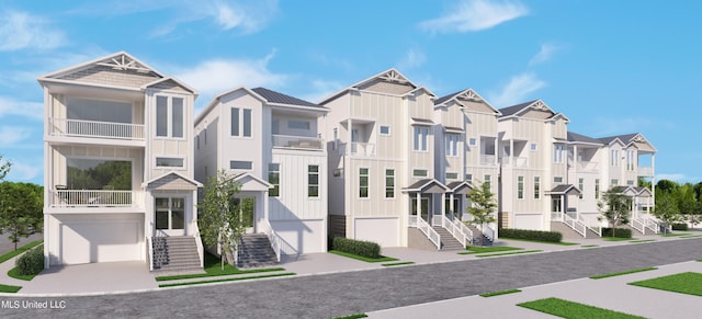 1851 Beach Blvd Unit 4, Biloxi, MS 39531 - townhome / multi-family property featuring board and batten siding, a residential view, and a garage