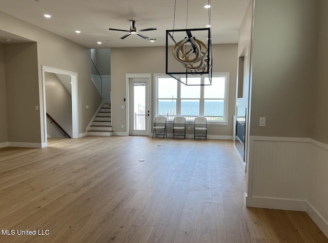 1851 Beach Blvd Unit 4, Biloxi, MS 39531 - living room with stairway, light wood-type flooring, ceiling fan, recessed lighting, and baseboards