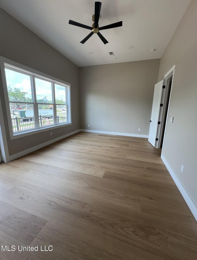 1851 Beach Blvd Unit 4, Biloxi, MS 39531 - spare room featuring baseboards, ceiling fan, and wood finished floors