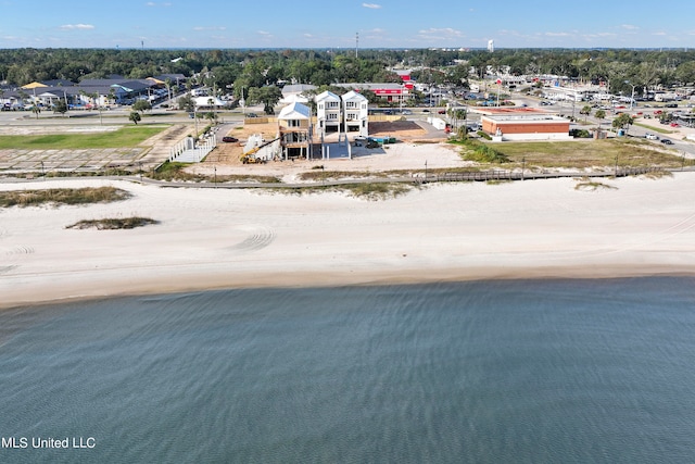 birds eye view of property with a view of the beach and a water view