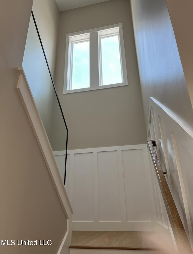1851 Beach Blvd Unit 4, Biloxi, MS 39531 - stairs with a decorative wall and wainscoting