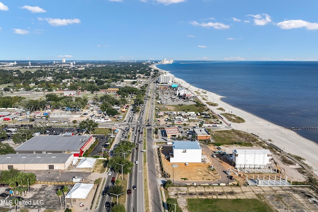 drone / aerial view featuring a view of the beach and a water view