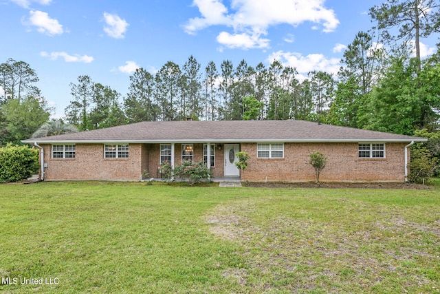 single story home featuring a front lawn