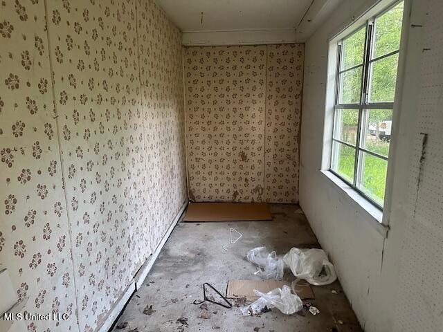 11187 Dewey Lawrence Cir, Diberville, MS 39540 - spare room with wallpapered walls