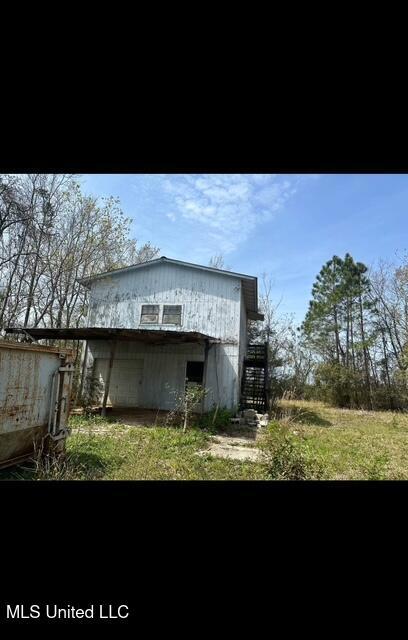 11187 Dewey Lawrence Cir, Diberville, MS 39540 - view of side of home featuring stairway
