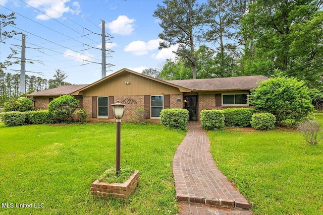 101 Lake Of Pines Dr, Jackson, MS 39206 - ranch-style house featuring brick siding and a front yard