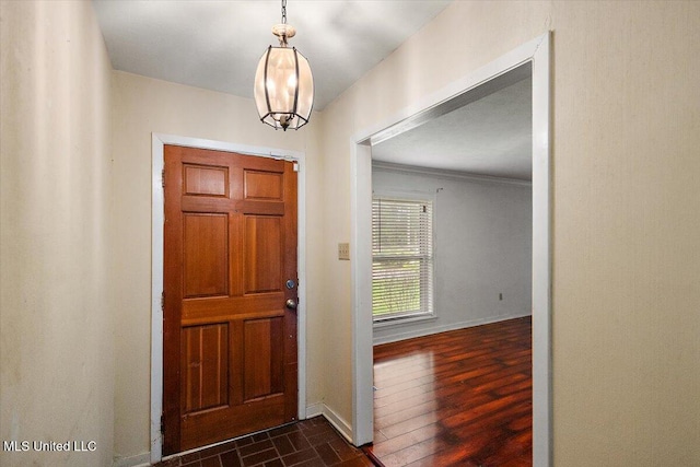 101 Lake Of Pines Dr, Jackson, MS 39206 - foyer entrance featuring baseboards, ornamental molding, and dark wood-style flooring