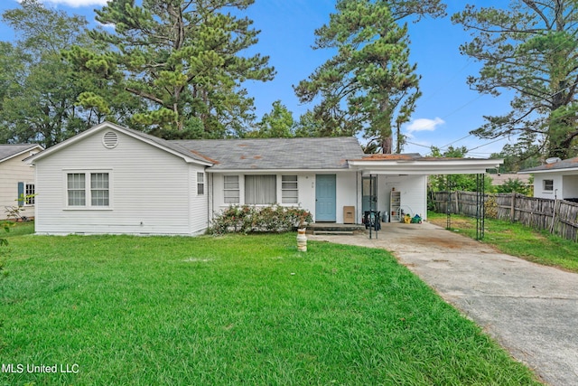 ranch-style house featuring a carport and a front lawn