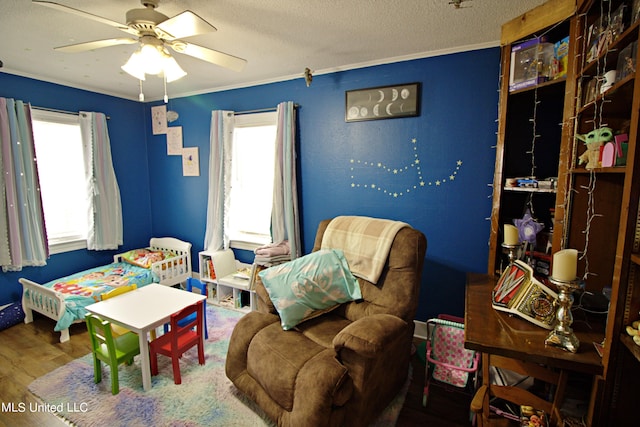 bedroom featuring crown molding, hardwood / wood-style flooring, and multiple windows