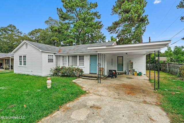 ranch-style house with a front lawn and a carport