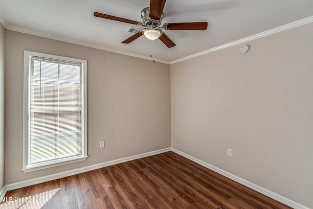 empty room with dark wood-style floors, visible vents, baseboards, ceiling fan, and ornamental molding