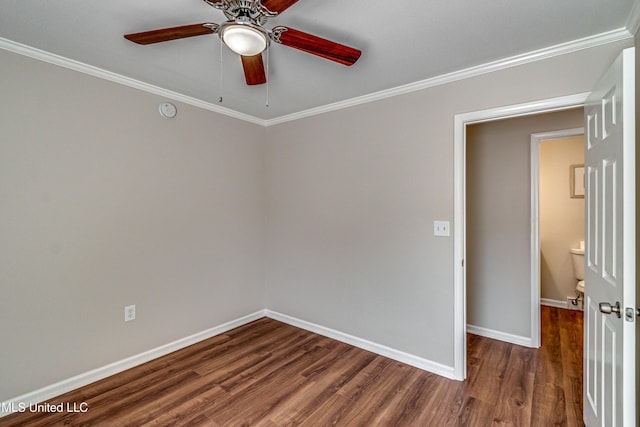 unfurnished room featuring dark wood finished floors, ceiling fan, baseboards, and ornamental molding