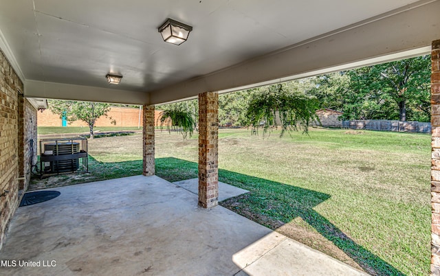 view of patio / terrace featuring fence